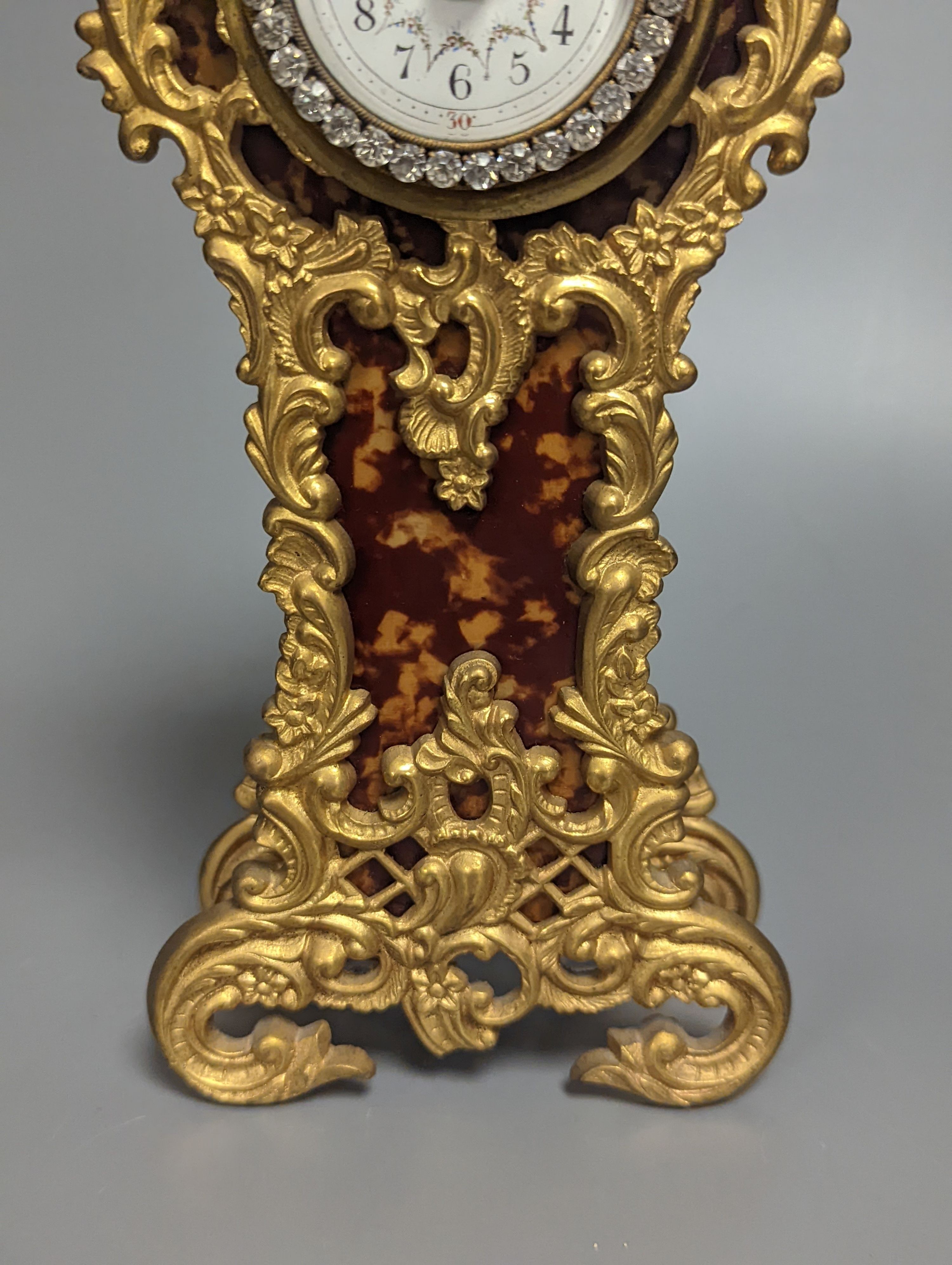 A French timepiece, with paste-set face, in simulated tortoiseshell case, height 25cm